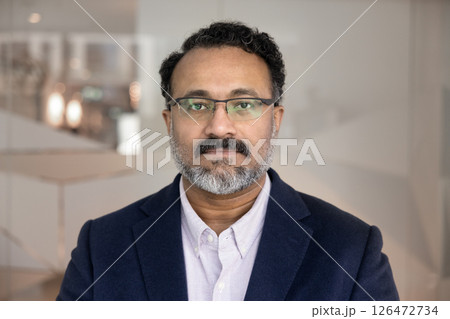 Head shot close up portrait of serious Indian businessman 126472734