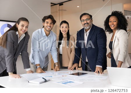 Multiethnic marketing team or business consultants discussing project updates Multiethnic marketing team or business consultants discussing project updates 126472753