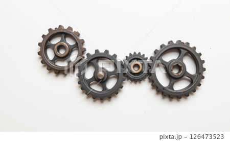 Gears arranged in a creative layout on a light background. 126473523