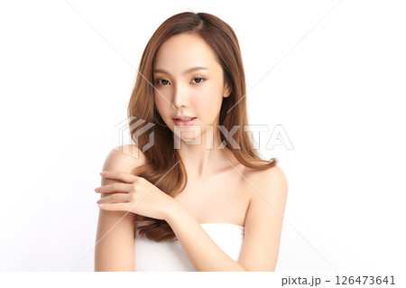 A beautiful young Asian woman with clean, fresh skin against a white background. Skincare, facial treatment, cosmetology, beauty, and spa. An elegant portrait of an Asian woman. A beautiful young Asian woman with clean, fresh skin against a white background. Skincare, facial treatment, cosmetology, beauty, and spa. An elegant portrait of an Asian woman. 126473641