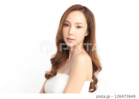 A beautiful young Asian woman with clean, fresh skin against a white background. Skincare, facial treatment, cosmetology, beauty, and spa. An elegant portrait of an Asian woman. A beautiful young Asian woman with clean, fresh skin against a white background. Skincare, facial treatment, cosmetology, beauty, and spa. An elegant portrait of an Asian woman. 126473649