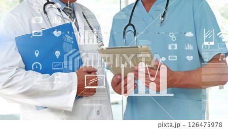 Image of data processing and diagrams over caucasian male doctors using tablet in hospital 126475978