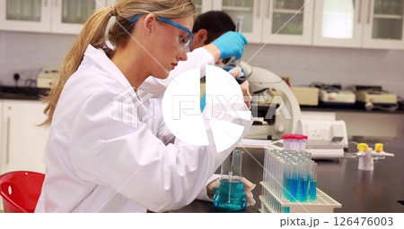 Image of white diagram over caucasian scientists taking sample in lab 126476003