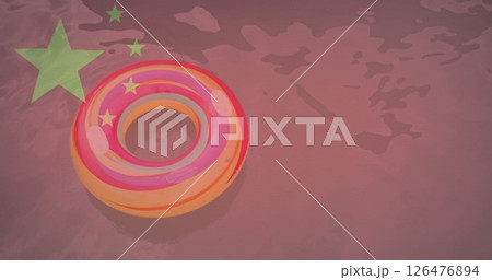 Colorful inflatable ring floating in water with chinese flag image over it Colorful inflatable ring floating in water with chinese flag image over it 126476894