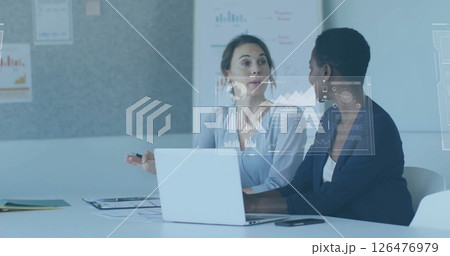 Image of financial data processing over diverse businesswomen in office Image of financial data processing over diverse businesswomen in office 126476979