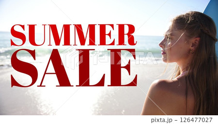 Summer sale text over woman standing on beach 126477027