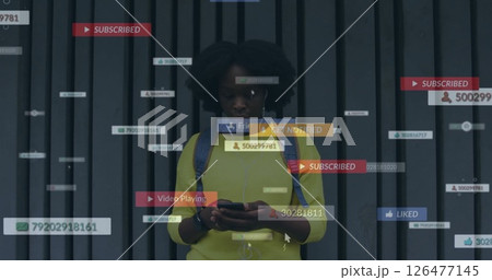 Notifications and social media interactions image over woman using smartphone 126477145