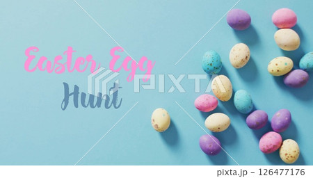 Image of easter egg hunt and happy easter text over blue background Image of easter egg hunt and happy easter text over blue background 126477176