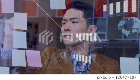 Image of graphs and processing data over asian casual businessman brainstorming at office Image of graphs and processing data over asian casual businessman brainstorming at office 126477187