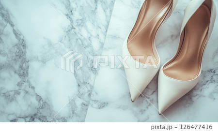 Elegant white stiletto heels on luxurious marble background, bridal fashion concept with copy space for text 126477416