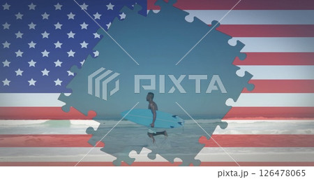 Image of flag of usa over african american man with surfboard running on beach 126478065