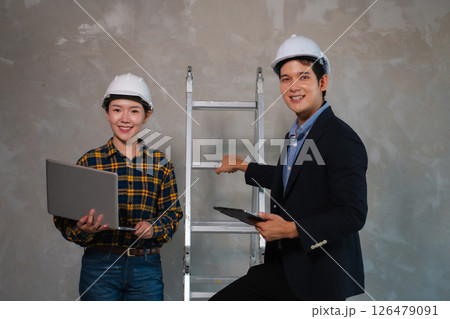 profession concept, successfully engineer teams meeting, looking to camera. 126479091