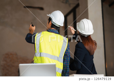 architect team on construction site inspection documents and business workflow in the morning. architect team on construction site inspection documents and business workflow in the morning. 126479119