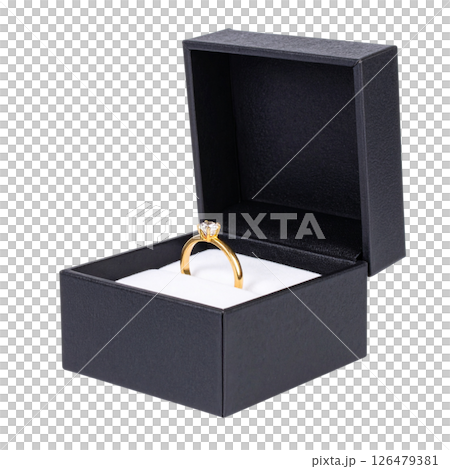 Open wooden gift box with a gold engagement ring 126479381