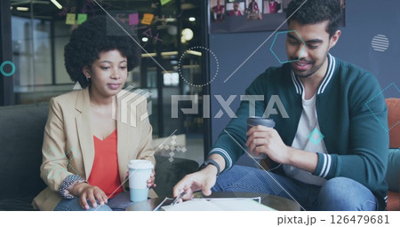 Image of financial data processing over diverse business people in office Image of financial data processing over diverse business people in office 126479681