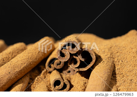 Fine Ground Cinnamon with Cinnamon Sticks. Natural Cooking Spice 126479963