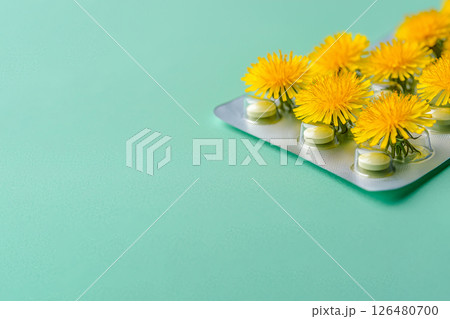 blister with pills and dandelion flowers, homeopathy, sedative, allergy 126480700