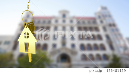 Image of golden key and house over white building 126481129