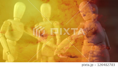 Wooden mannequins shaking hands in abstract orange and yellow cloud background 126482783