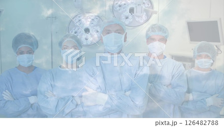 Medical team in surgical scrubs standing confidently in operating room 126482788