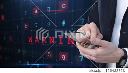 Businessman using smartphone with digital warning message on futuristic interface Businessman using smartphone with digital warning message on futuristic interface 126482828