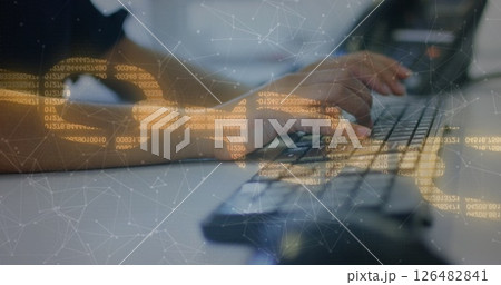 Hands typing on keyboard with digital data overlay, focusing on technology 126482841