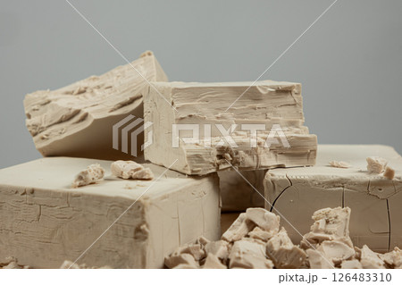 Fresh Compressed Yeast Blocks on Gray Background Fresh Compressed Yeast Blocks on Gray Background 126483310