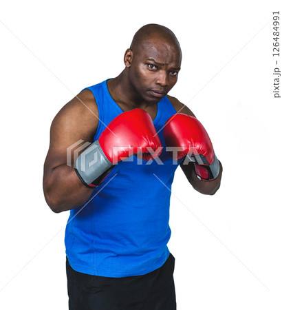 Boxer in blue tank top posing with red gloves, ready for action Boxer in blue tank top posing with red gloves, ready for action 126484991