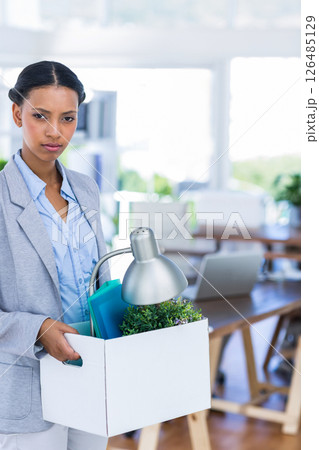 Businesswoman carrying box with office supplies, transitioning to new opportunity, copy space 126485129