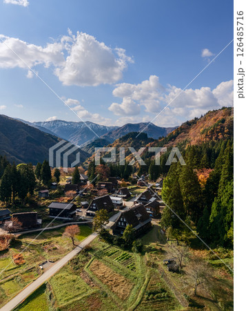 Drone view of Ainokura village in Toyama, Japan on a crisp autumn morning with gassho houses Drone view of Ainokura village in Toyama, Japan on a crisp autumn morning with gassho houses 126485716