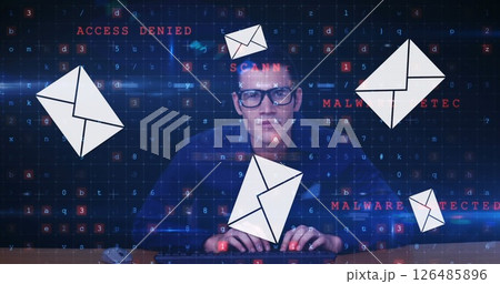 Cybersecurity expert analyzing digital threats on computer with floating email icons 126485896