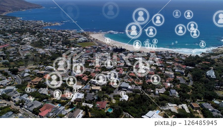 Aerial view of coastal town with digital social network icons overlaying community Aerial view of coastal town with digital social network icons overlaying community 126485945