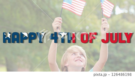 Child celebrating Independence Day holding American flags outdoors, smiling joyfully Child celebrating Independence Day holding American flags outdoors, smiling joyfully 126486198