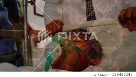 Medical team assisting patient with oxygen mask in hospital during pandemic crisis Medical team assisting patient with oxygen mask in hospital during pandemic crisis 126486248