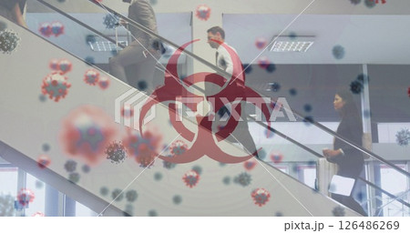 Business professionals walking on stairs with biohazard symbol and virus overlay 126486269