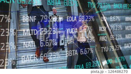 Business professionals walking with luggage, stock market data overlaying their path 126486270