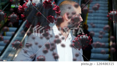 Businessman in suit walking through escalator surrounded by digital virus graphics Businessman in suit walking through escalator surrounded by digital virus graphics 126486315