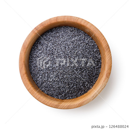 Poppy seeds in a wooden plate on a white background. Top view 126488024