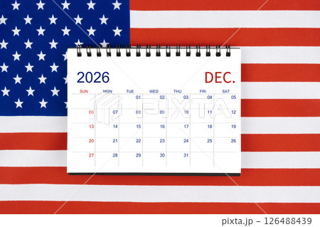 December 2026 desk calendar on United States of America flag. December 2026 desk calendar on United States of America flag. 126488439