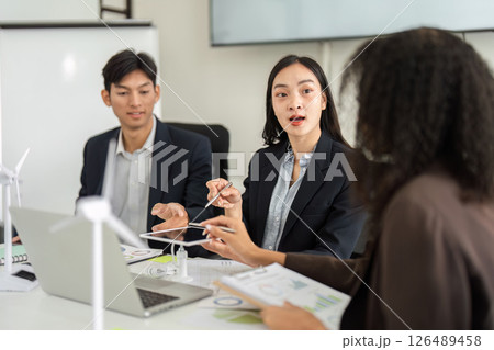 Renewable Energy Planning and Team Dynamics. Engaging discussion about sustainable models led by a committed team. 126489458