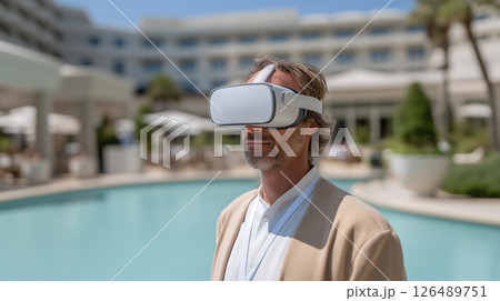 Business traveler experiencing virtual reality at luxury resort 126489751