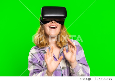 Excited woman in VR headset helmet watching virtual reality 3D video, playing simulation online game 126490855