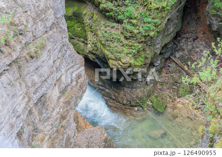 Waterfall, Rocks, Forest - View of a Waterfall Flowing Through a Gorge in a Forest. 126490955