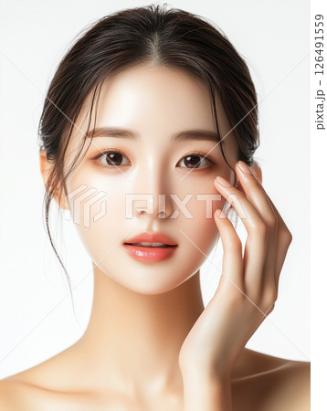 Korean woman with natural beauty showcasing soft features and gentle expression in bright studio lighting 126491559