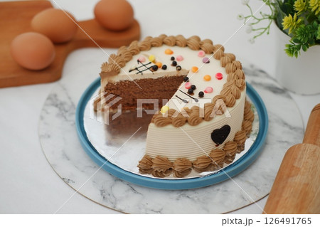Delicious Birthday Cake with Cherries and Chocolate Decoration 126491765