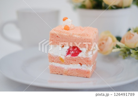 Piece of cake and cup of tea on white background, stock photo Piece of cake and cup of tea on white background, stock photo 126491789