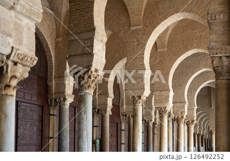 Long corridors under vaulted ceiling in ancient mosque of Kairouan in Tunisia. Long corridors under vaulted ceiling in ancient mosque of Kairouan in Tunisia. 126492252