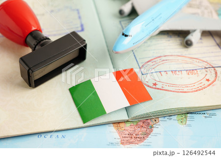 Italy passport with approved stamp on document for tourism to immigration at airport in country. 126492544