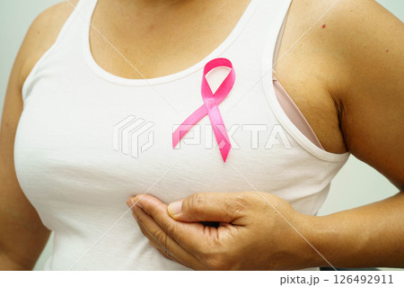 Asian woman with pink ribbon for October world breast cancer day. 126492911