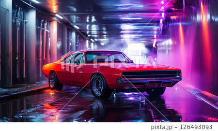 Red muscle car gleams under colorful lights in dark tunnel car wash 126493093